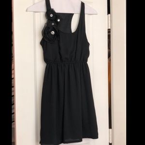 Black mini dress with flower embellishment
